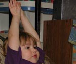 Liralyn with her arms in the air