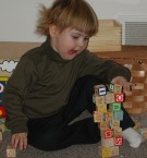 Photo of Liralyn playing with blocks