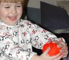 Photo of Mommy and Liralyn playing with yarn